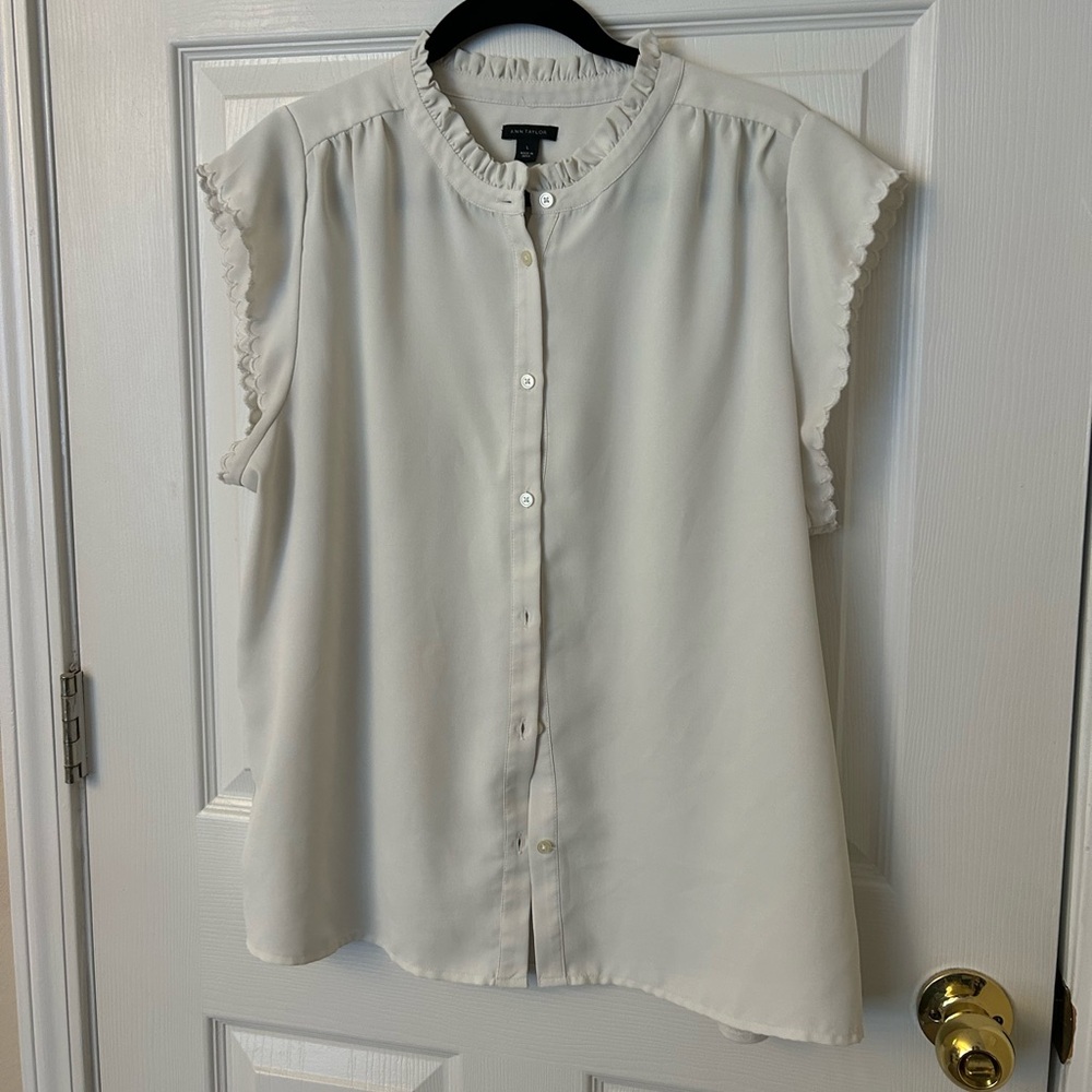 Cream ruffle top from Ann Taylor. Button up size large.